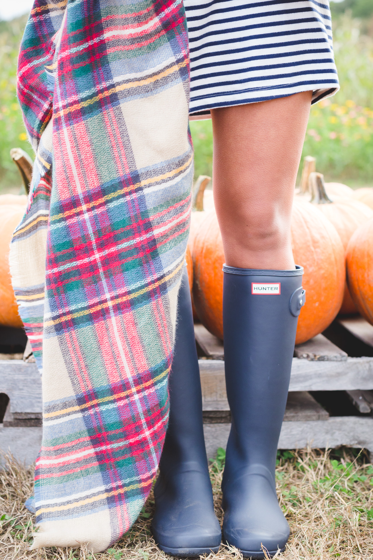 plaid blanket scarf, what to wear to a pumpkin patch, fall pumpkin patch, fall fashion, fall style, fall preppy outfit, quilted vest, excursion vest, stripe dress, hunter boots, tour packable hunter boots, fall blanket scarf, fall outfit ideas // grace wainwright from a southern drawl