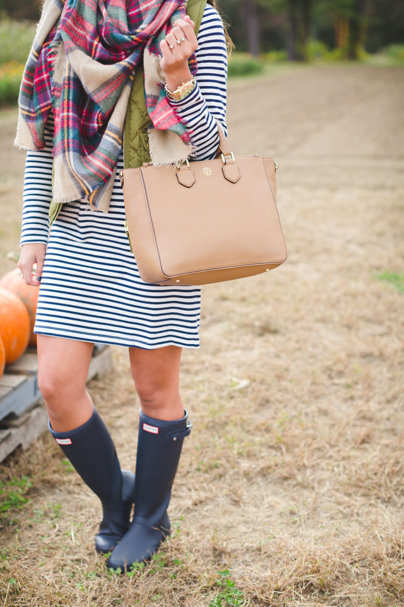 plaid blanket scarf, what to wear to a pumpkin patch, fall pumpkin patch, fall fashion, fall style, fall preppy outfit, quilted vest, excursion vest, stripe dress, hunter boots, tour packable hunter boots, fall blanket scarf, fall outfit ideas // grace wainwright from a southern drawl