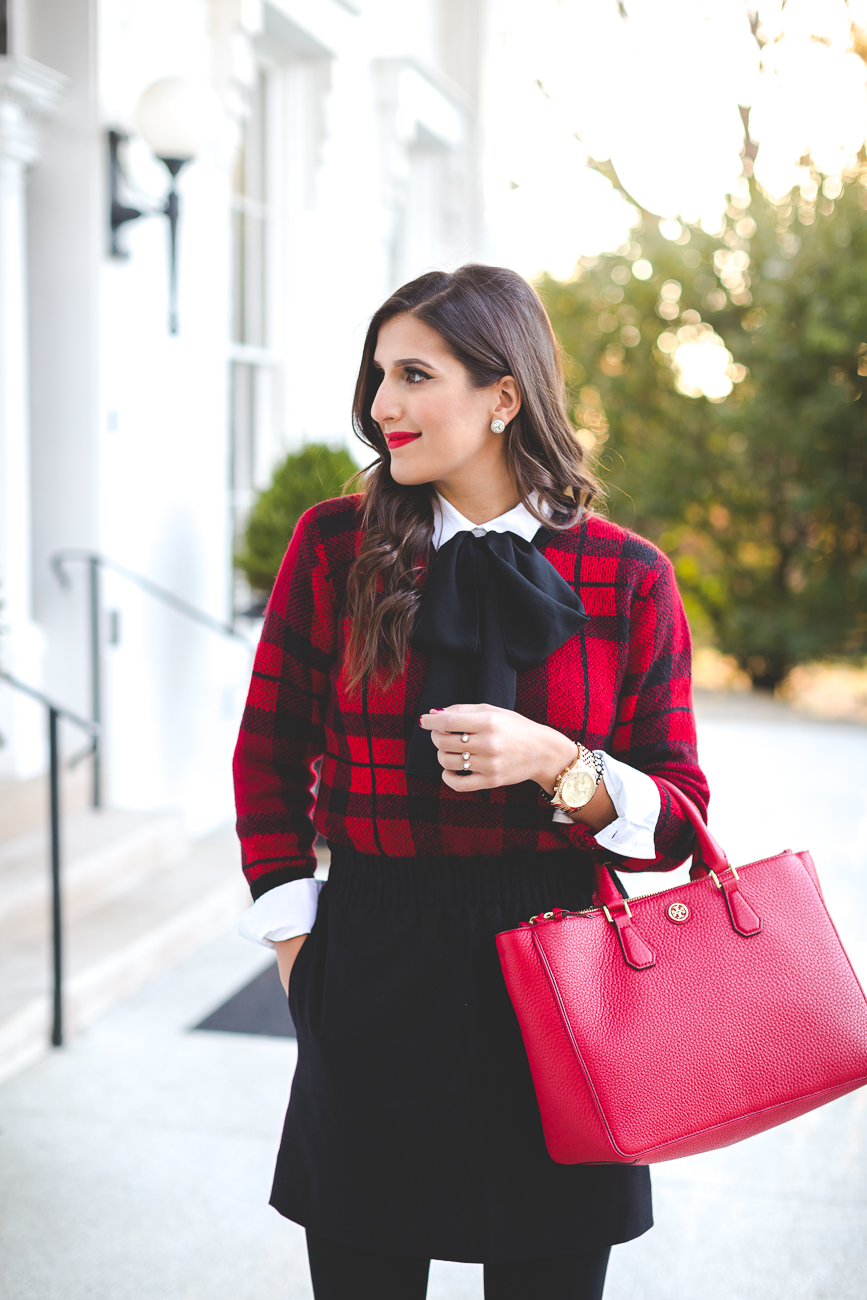 holiday look, holiday outfits, red tory burch robinson tote, red tory burch purse, christmas wreath, tie neck blouse, plaid sweater, kendra scott double ring, christmas look, holiday outfit ideas, holiday party look // grace wainwright from a southern drawl