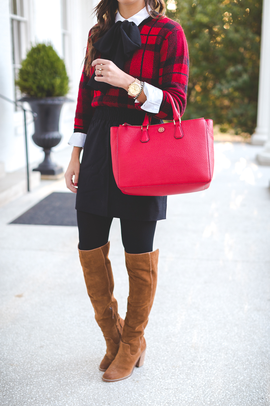 holiday look, holiday outfits, red tory burch robinson tote, red tory burch purse, christmas wreath, tie neck blouse, plaid sweater, kendra scott double ring, christmas look, holiday outfit ideas, holiday party look // grace wainwright from a southern drawl