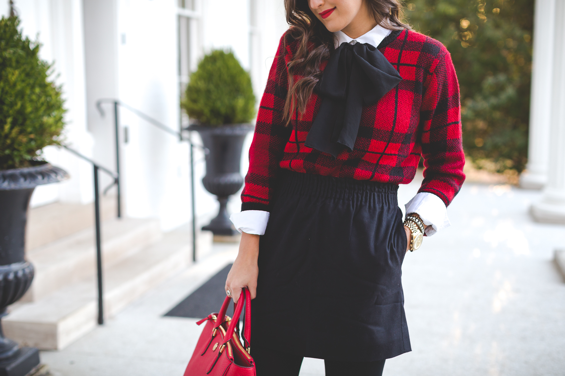 holiday look, holiday outfits, red tory burch robinson tote, red tory burch purse, christmas wreath, tie neck blouse, plaid sweater, kendra scott double ring, christmas look, holiday outfit ideas, holiday party look // grace wainwright from a southern drawl
