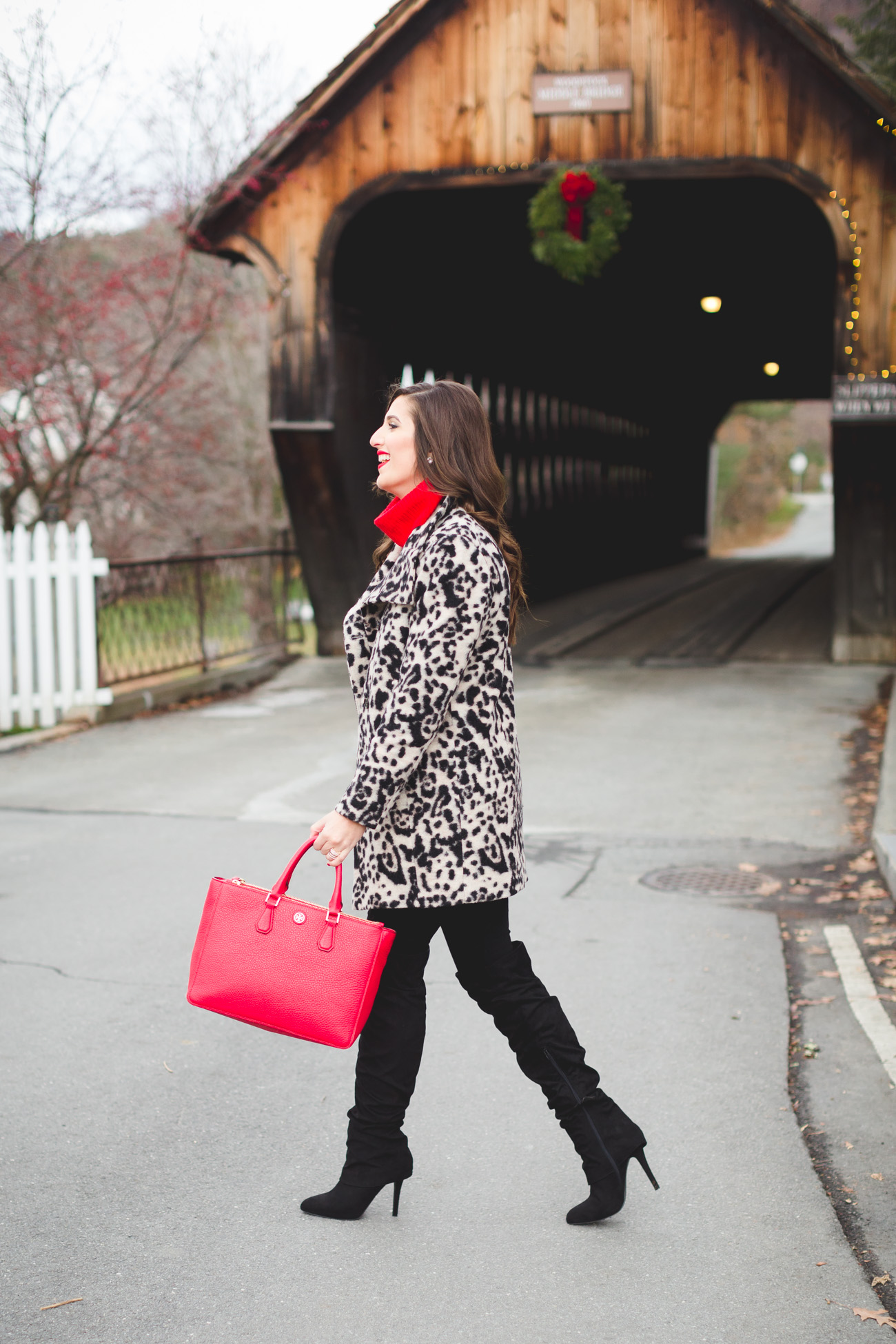 covered bridge, woodstock vermont, woodstock vt, leopard coat, statement coat, red turtleneck, over the knee boots, red tory burch robinson pebbled tote, holiday outfit ideas, holiday style, christmas outfit, holiday party outfit // grace wainwright from a southern drawl