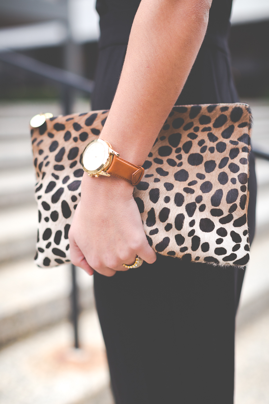 black jumpsuit, cross straps, statement necklace, calf hair clutch, leopard clutch, all black outfit, sleek jumpsuit // grace wainwright from a southern drawl