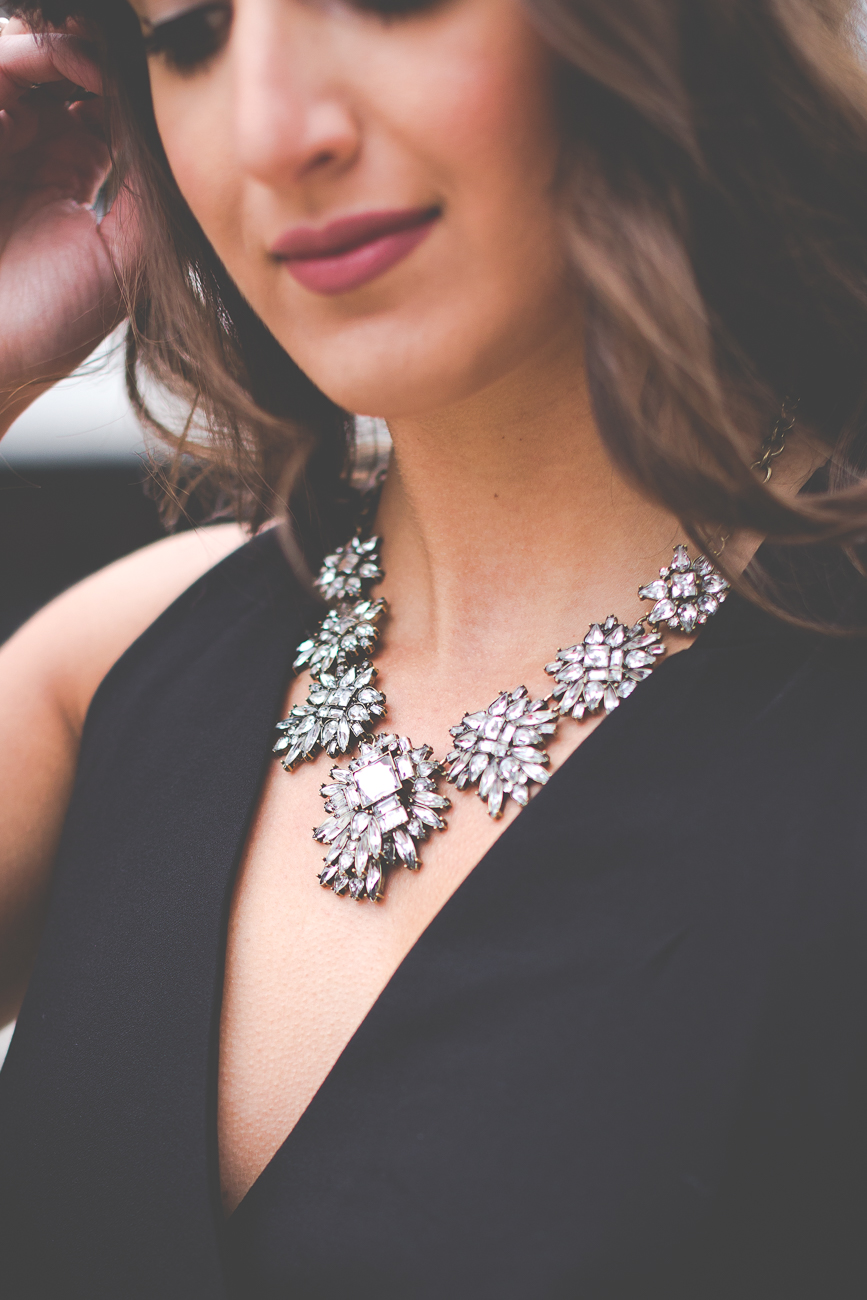 black jumpsuit, cross straps, statement necklace, calf hair clutch, leopard clutch, all black outfit, sleek jumpsuit // grace wainwright from a southern drawl
