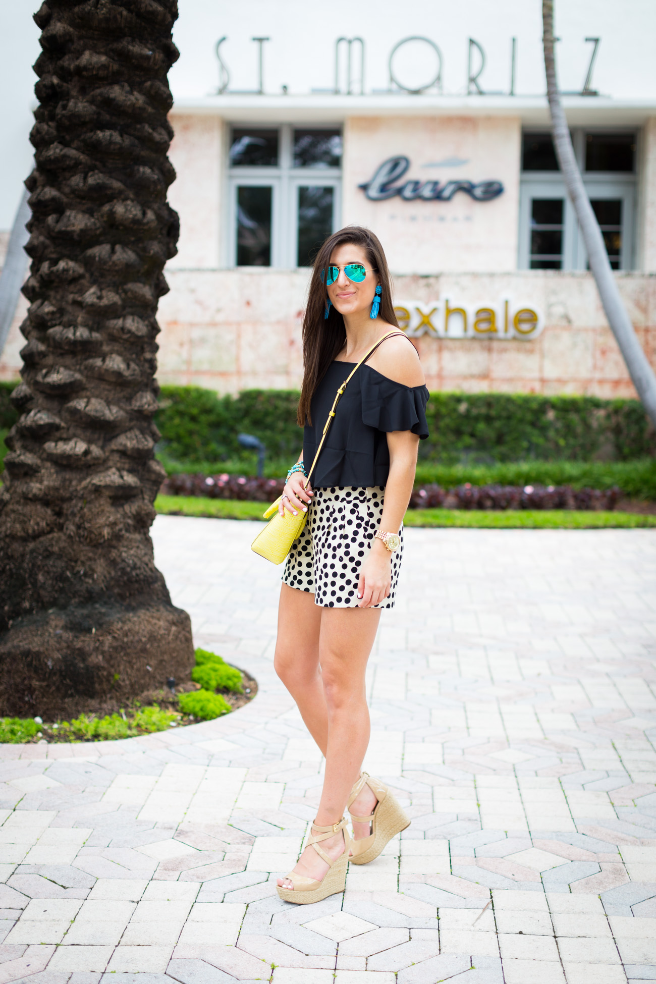 polka dot shorts, cold shoulder top, off the shoulder top, tropical style, vacation style, spring outfit, turquoise tassel earrings, nude wedge sandals, nude espadrille sandals // grace wainwright from a southern drawl