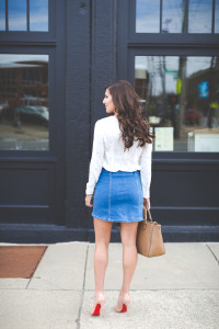 denim skirt, denim button skirt, embellished blouse, white embellished top, spring outfit ideas, spring fashion, nude christian louboutins, christian louboutin so kate pumps, red soles, denim spring outfit, embellished wrap top, jeweled blouse // grace wainwright from a southern drawl