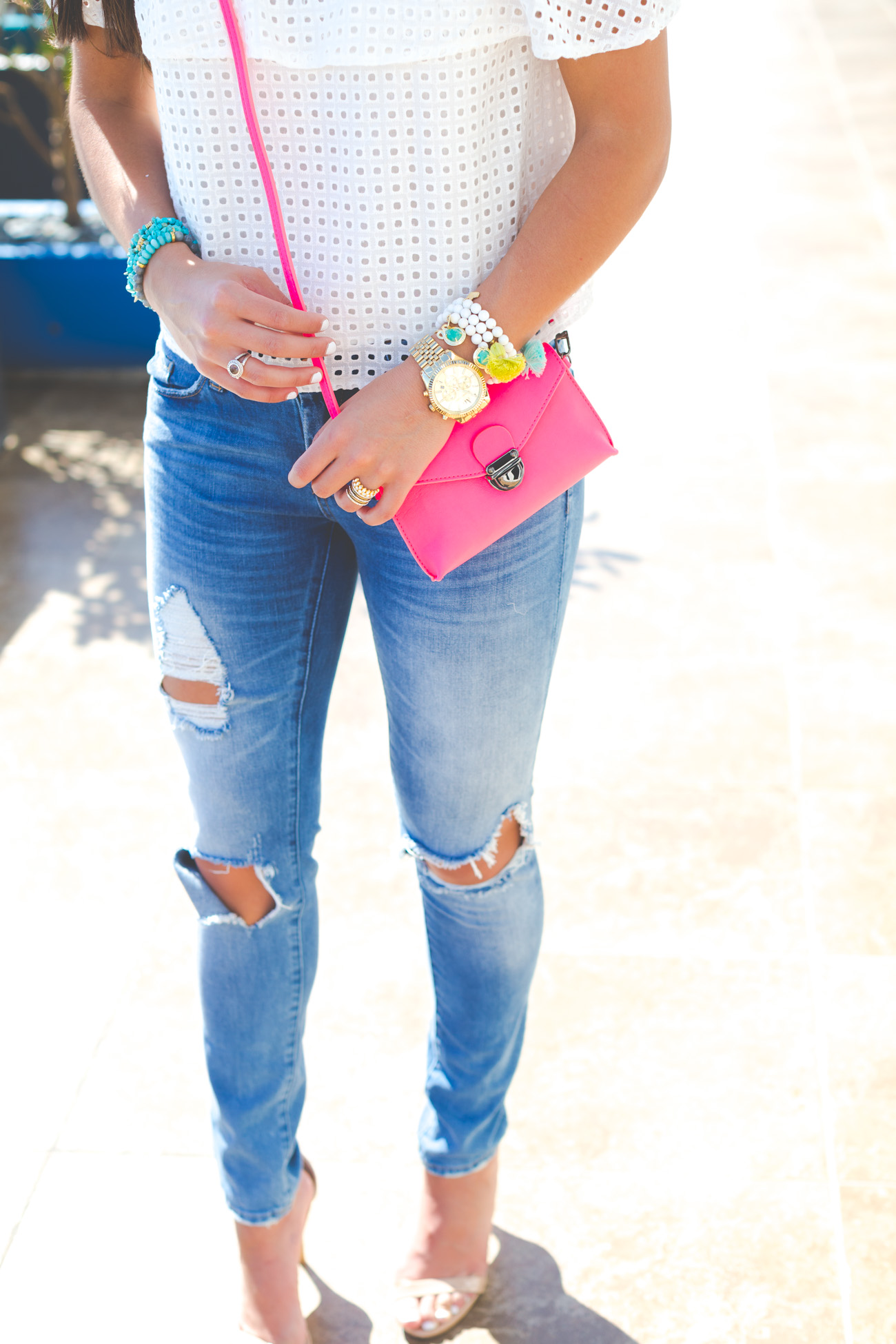 white off the shoulder top, off the shoulder frill top, beach style, beach fashion, vacation outfit, vacation style, pink crossbody bag, fuchsia crossbody bag, blue tassel earrings, blue statement earrings, chan luu turquoise wrap bracelets // grace wainwright from a southern drawl