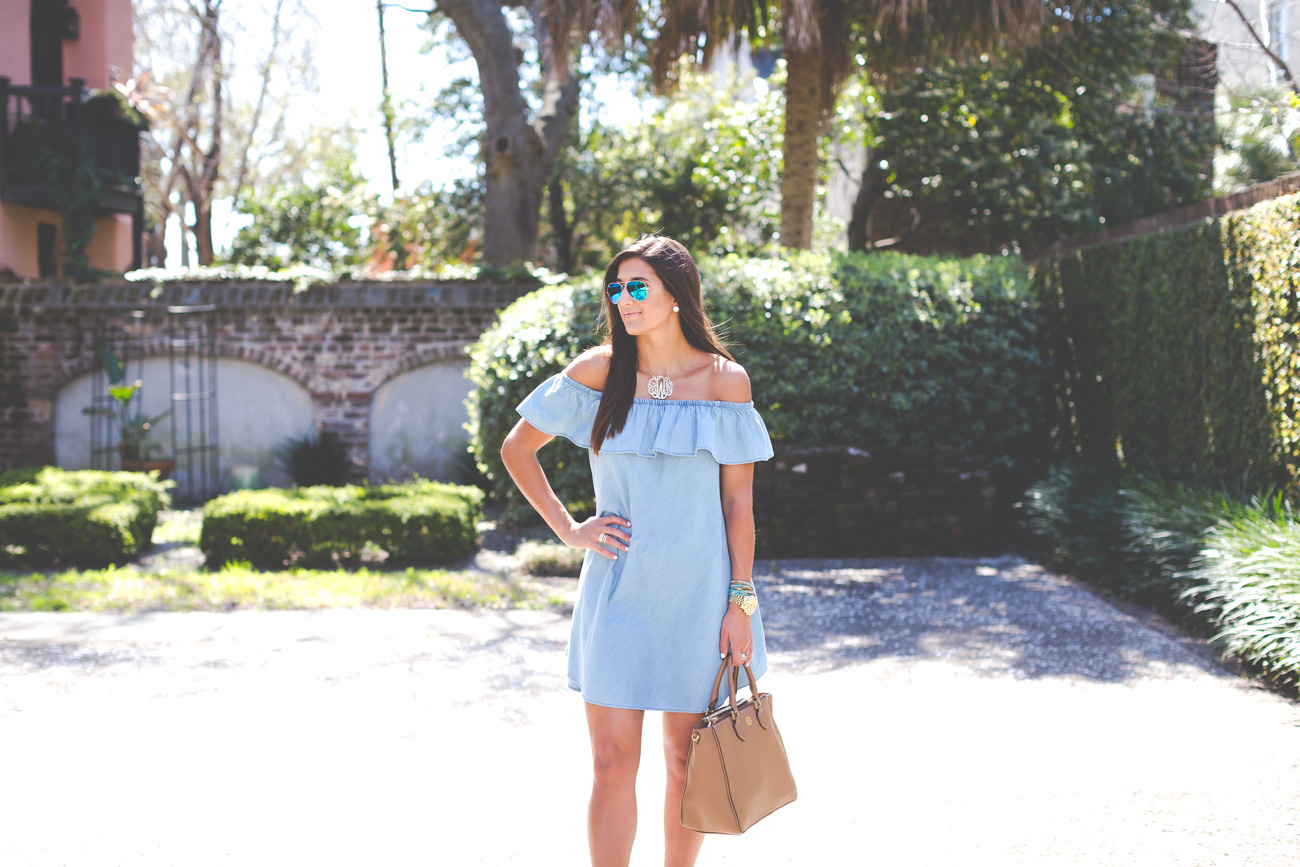 chambray off the shoulder dress, spring fashion, spring outfit ideas, charleston south carolina, off the shoulder top, chambray dress, chambray outfit, extra large gold monogram necklace, monogram chain, preppy style, preppy fashion, feminine outfit, girly outfit, ruffle dress, off the shoulder ruffle dress // grace wainwright from a southern drawl