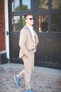 wedding guest outfit, little black dress, couples style, couples fashion, couples goals, black cutout dress, black fit and flare dress, statement earrings, drop earrings, red lipstick, express men fashion, express women fashion, express style, black quilted crossbody purse, graduation outfit // grace wainwright a southern drawl