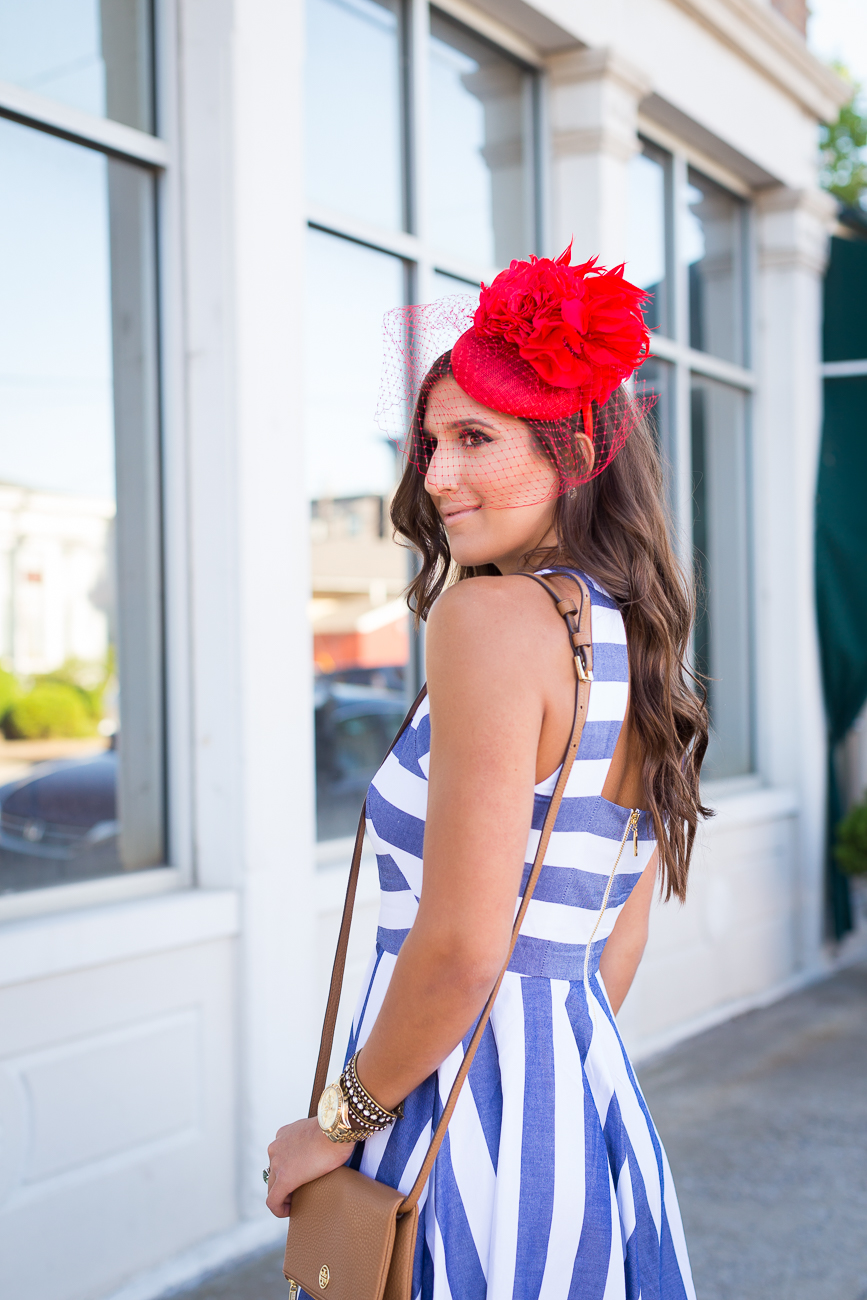stripe midi dress, kentucky derby hat, floral fascinator, spring stripe dress, stripe fit and flare dress, gold monogram necklace, tory burch foldover crossbody bag, kentucky derby outfit, what to wear to the kentucky derby, kentucky oaks, red fascinator, wedding guest outfit, eliza j dress, preppy outfit ideas, preppy fashion, spring dress, spring fashion, preppy spring outfit, preppy spring fashion, preppy spring dress, large monogram necklace, kentucky derby attire // grace wainwright a southern drawl