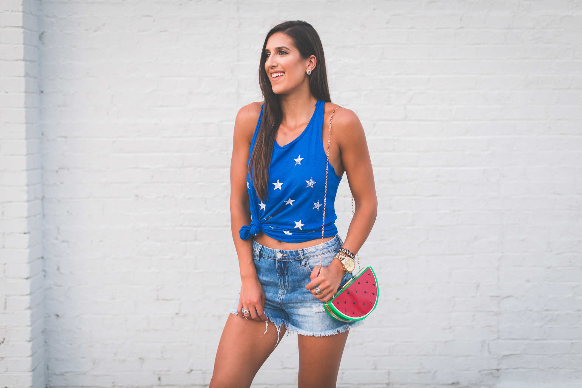 star print racerback tank, fourth of july outfit, fourth of july fashion, merican tank, star tank, watermelon purse, watermelon bag, watermelon crossbody bag, denim cutoffs, high waist denim shorts, high waist denim cutoffs, july fourth outfit ideas, fun july fourth outfits, fruit purse, summer outfit ideas, knotted tee, how to knot your tank, knotted tank, lace up sandals, lace up heels, sole society lyla sandals // grace wainwright a southern drawl