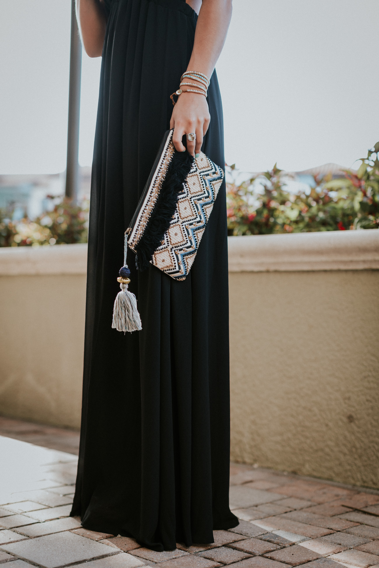 black halter maxi dress, show me your mumu dress, show me your mumu maxi, show me your mumu luna halter gown, vacation style, turquoise tassel earrings, nude wedges, strappy wedge sandals, tassel clutch // grace wainwright a southern drawl
