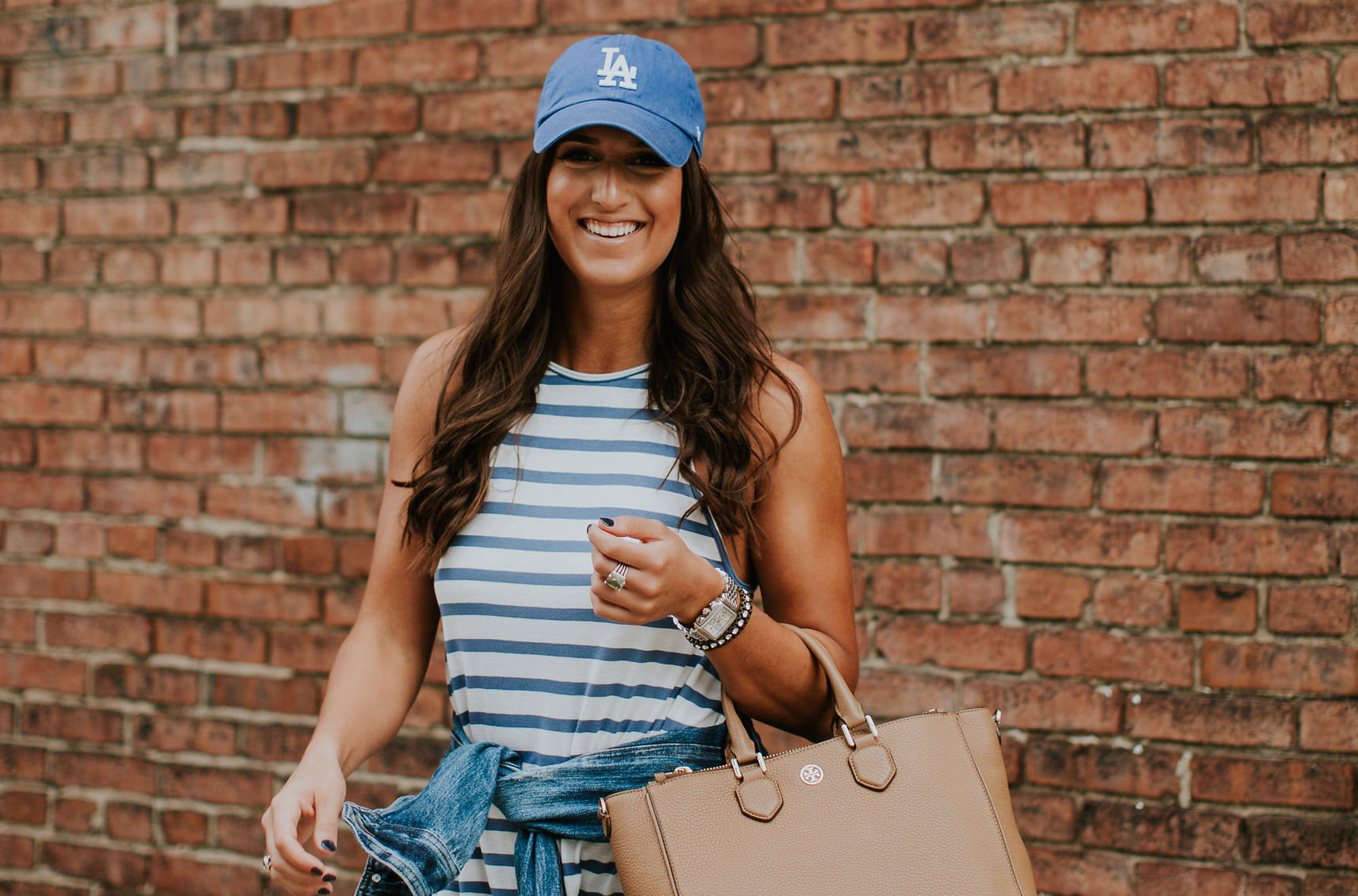 stripe swing dress, denim jacket, high top converse sneakers, high top chuck sneakers, high top chucks, la dodgers hat, tory burch robinson square tote, stripe dress, stripe mini dress, spring style, spring fashion // grace wainwright a southern drawl