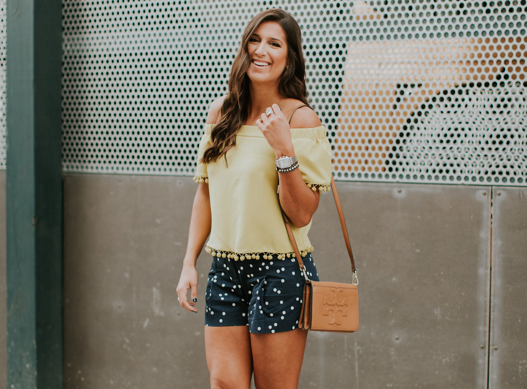 polka dot shorts, pom shirt, pom tassels, chartreuse top, off the shoulder top, off the shoulder pom top, tory burch crossbody bag, charles david wedge sandals, spring fashion, spring style, navy dot shorts, navy polka dot shorts, j.crew outfit, spring outfit // grace wainwright a southern drawl